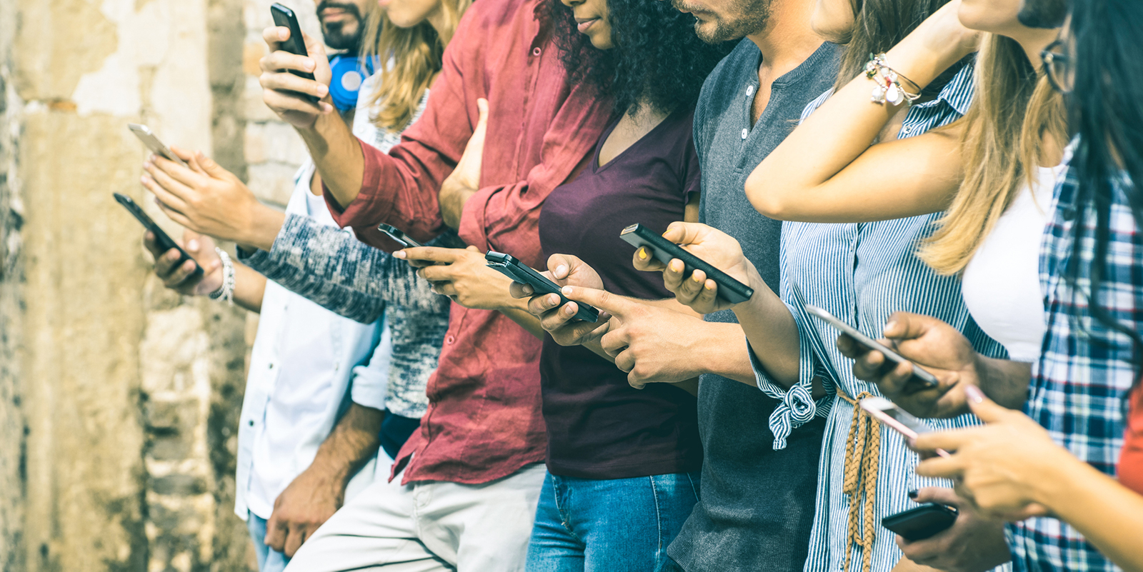 Group of people using smartphones together.