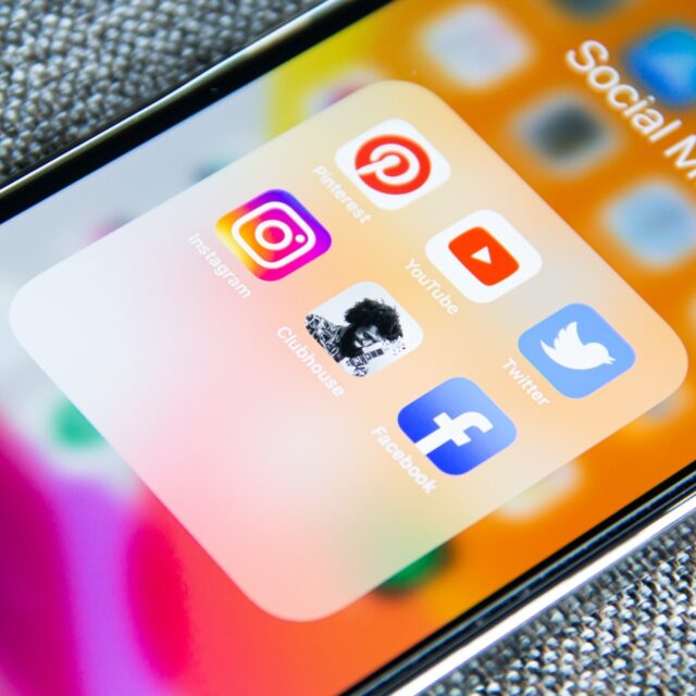 Close-up of social media apps on a smartphone screen.